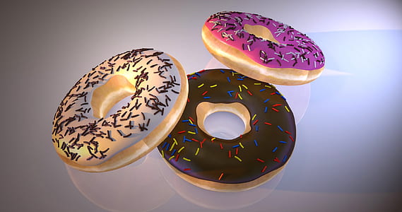 three doughnuts with icing and sprinkles thumbnail