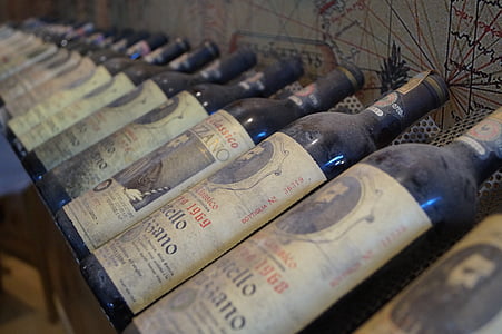 selective focus photography of wine bottle on shelf thumbnail