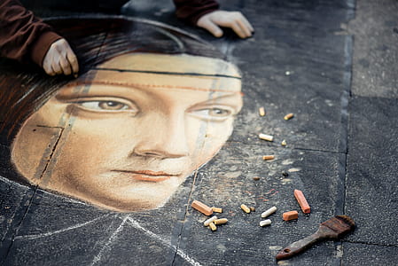 person painting woman's face thumbnail