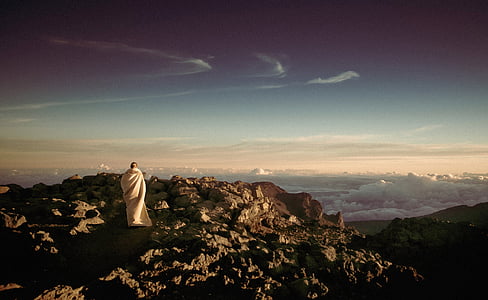 person on top of mountain during daytime thumbnail