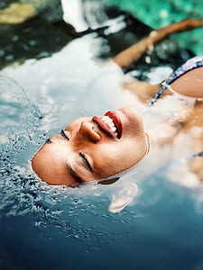 woman floating in water thumbnail