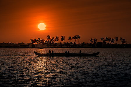 silhouette of canoe during sunset thumbnail