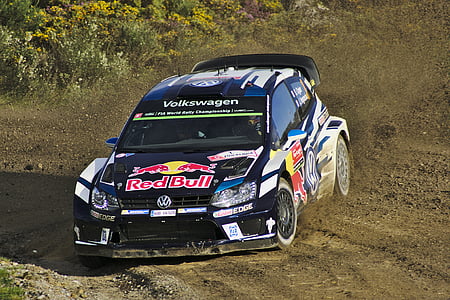 black Volkswagen RedBull rally vehicle on dirt road during daytime thumbnail