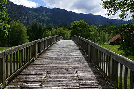 gray bridge within mountain range thumbnail