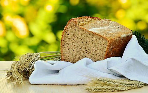 Brown Loft Bread in White Textile on Beige Table thumbnail