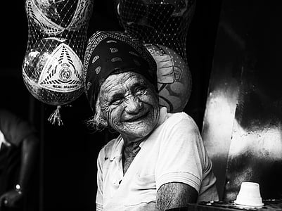 grayscale photo of smiling woman wearing white polo shirt thumbnail