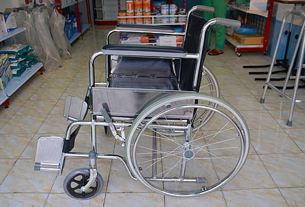 black and silver wheelchair on top of brown ceramic floor tikles thumbnail