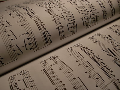 top view photography of music sheet thumbnail