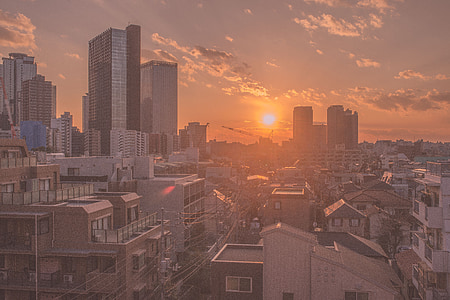 high-rise buildings under gray sky thumbnail
