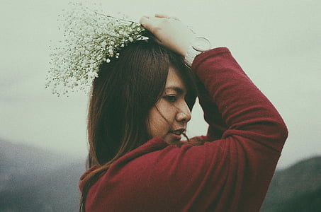 woman holding white flowers thumbnail