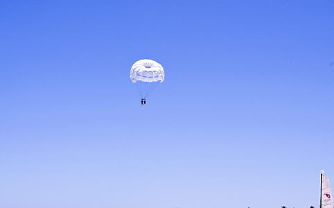 two person with parachute in the sky at daytime thumbnail