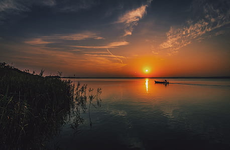 Person on a Boat Traveling during Sun Set thumbnail