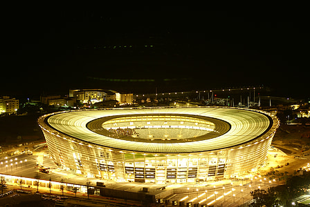 lighted stadium during nighttime thumbnail