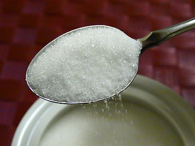 close-up photo of one spoon of white sugar thumbnail