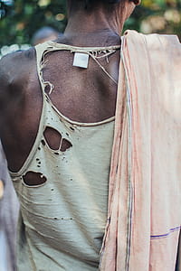 Selective Focus Photo Fo Person Wearing Distressed White Tank Top and Pink Scarf thumbnail