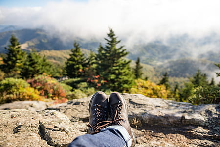 person sitting on top of mountain thumbnail