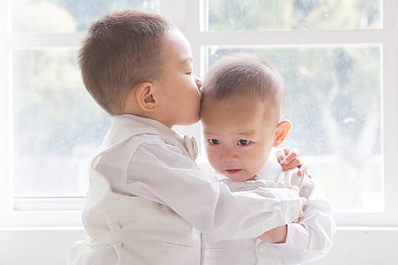 toddler kissing toddler in daytime thumbnail