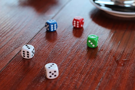 several dices on wooden table thumbnail