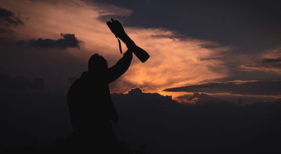 silhouette photo of a man thumbnail