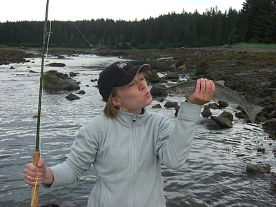 woman holding fish thumbnail