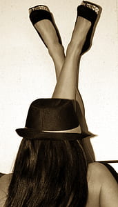 woman wearing brown fedora hat and black closed-toe shoes thumbnail