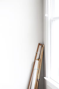white and brown window blinds beside white painted wall and glass window thumbnail