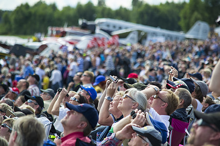crowd of people looking at the sky thumbnail