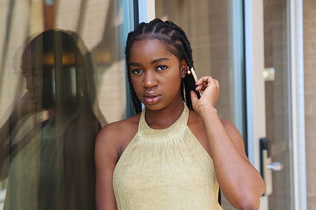 Woman in Brown Halter Shirt Holding Her Hair thumbnail