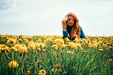 woman sitting on yellow dandelion field thumbnail