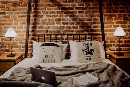 Enjoying evening with a Macbook in a nice bed thumbnail