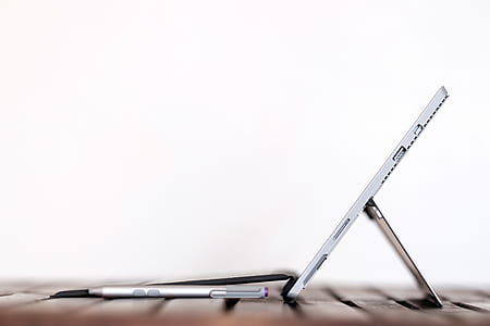 side view of gray tablet computer with white background thumbnail