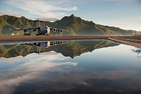 airplane landing on port near lake thumbnail