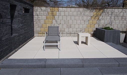 gray sunlounger outdoors near table thumbnail