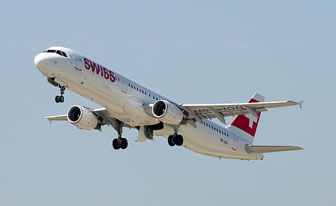white and red Swiss airplane in sky thumbnail