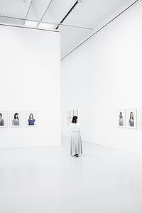 woman walking on art gallery thumbnail