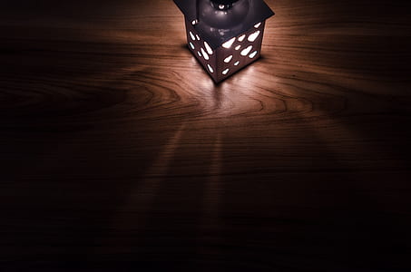 black lamp on brown wooden board thumbnail