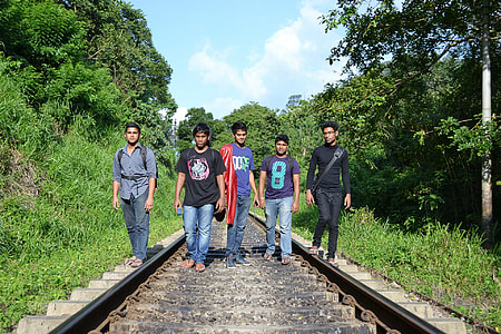 men standing on train railway thumbnail