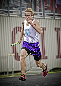 man in white tank top running holding green rolled paper thumbnail