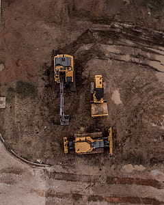 Aerial Photo Of Excavator, Road Roller, And Bulldozer thumbnail