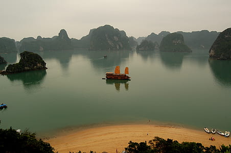 brown boat in the sea during daytime thumbnail
