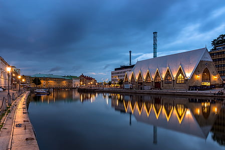 buildings surrounding body of water thumbnail