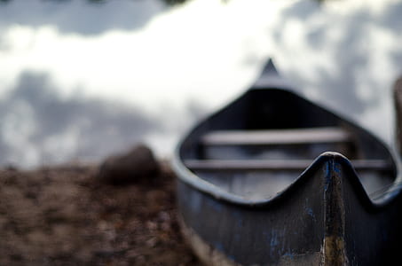 shallow focus photography of blue canoe thumbnail