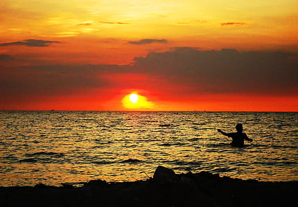 silhouette of person at body of water thumbnail