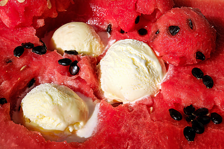 close-up photo of watermelon flavored ice cream with three scoops of vanilla ice cream thumbnail