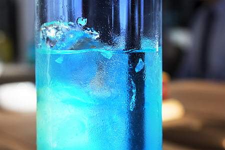 close-up photo of blue liquid in glass container thumbnail