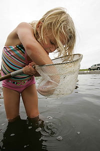 girl using net on water thumbnail