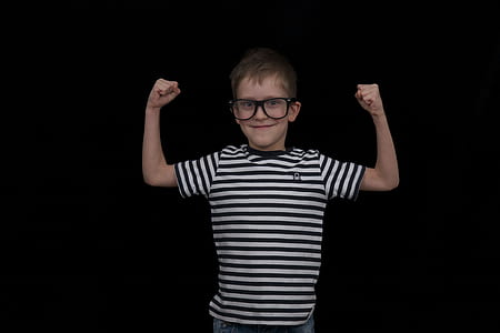 boy raising his hand wearing eyeglasses thumbnail