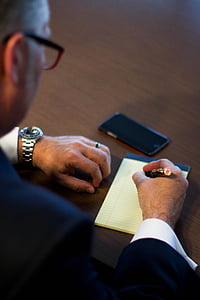 man writing on pad thumbnail