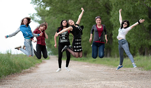 group of woman having jump shot photography during daytime thumbnail