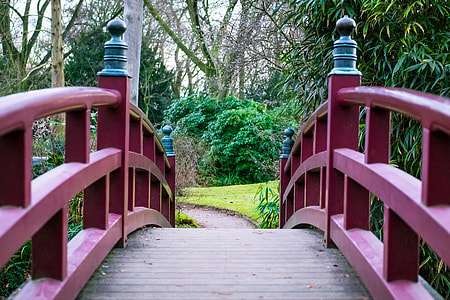 first person perspective photography of red bridge thumbnail
